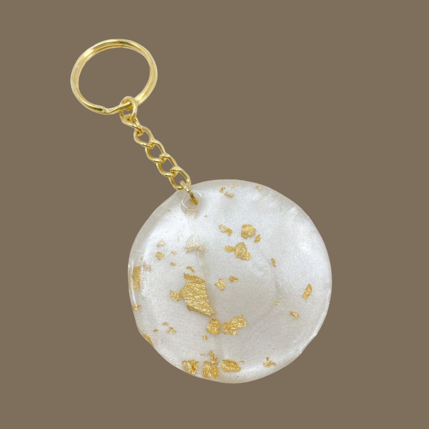 Runde Schlüsselanhänger mit Goldflocken