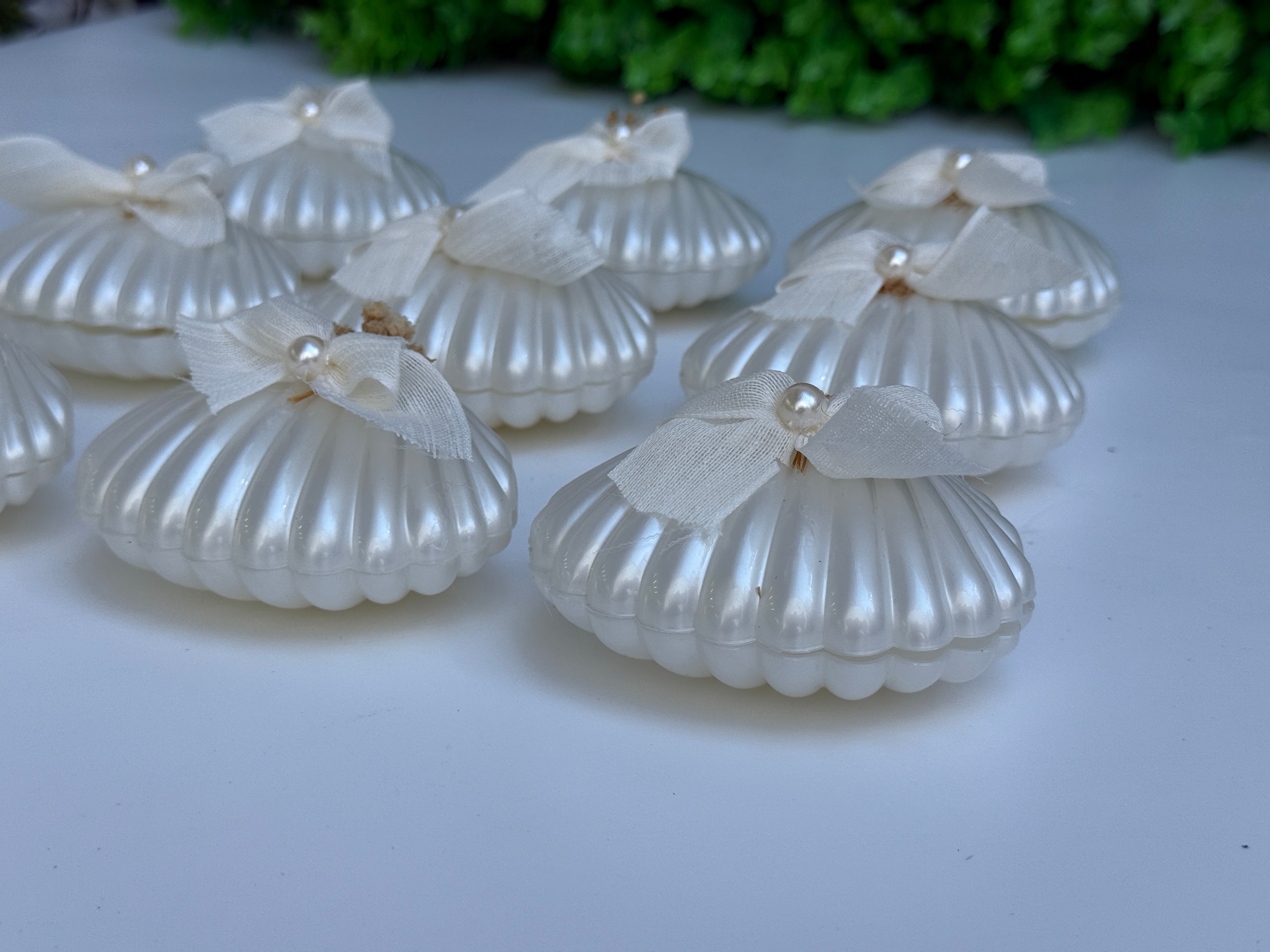Candela di conchiglia con perla