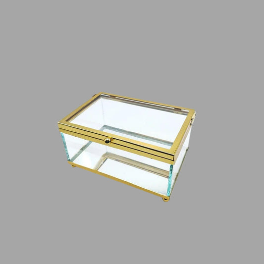 Rechteckige Glasbox mit goldenen Rahmen