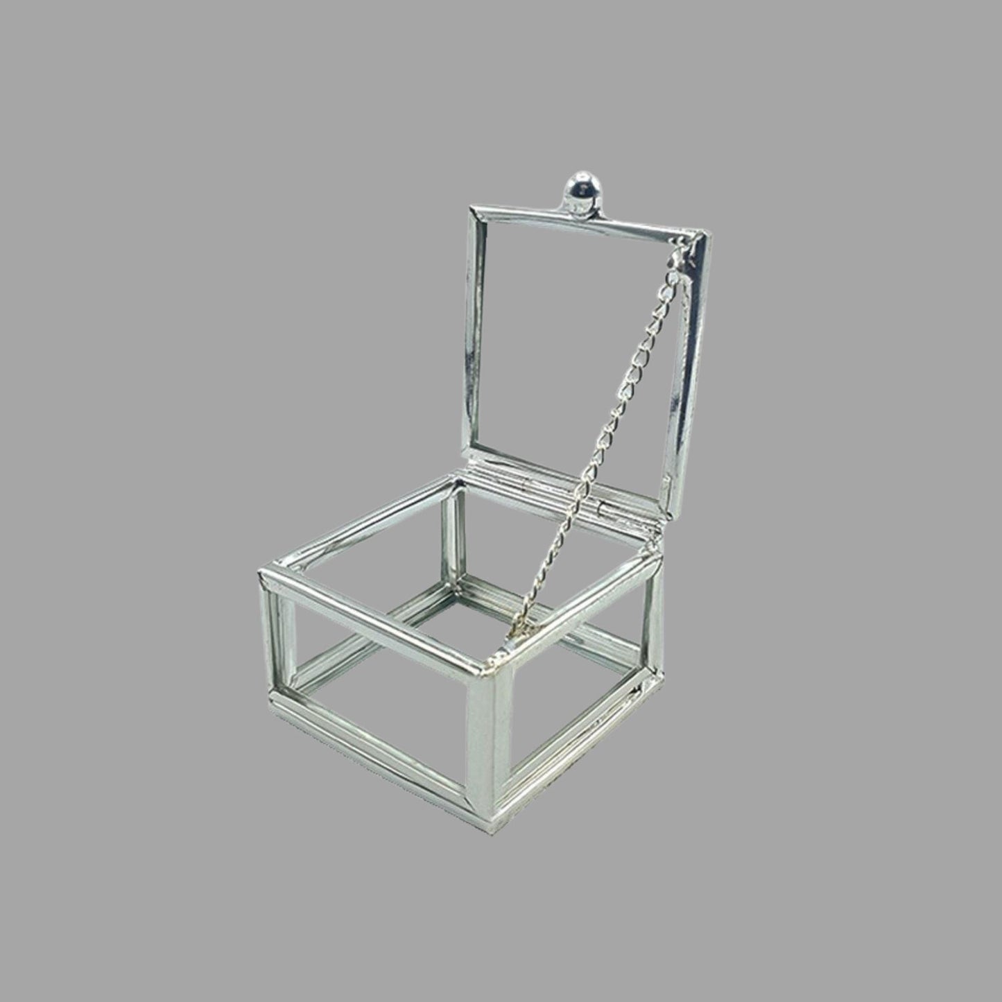 Sechseckige Glasbox mit Silberrahmen