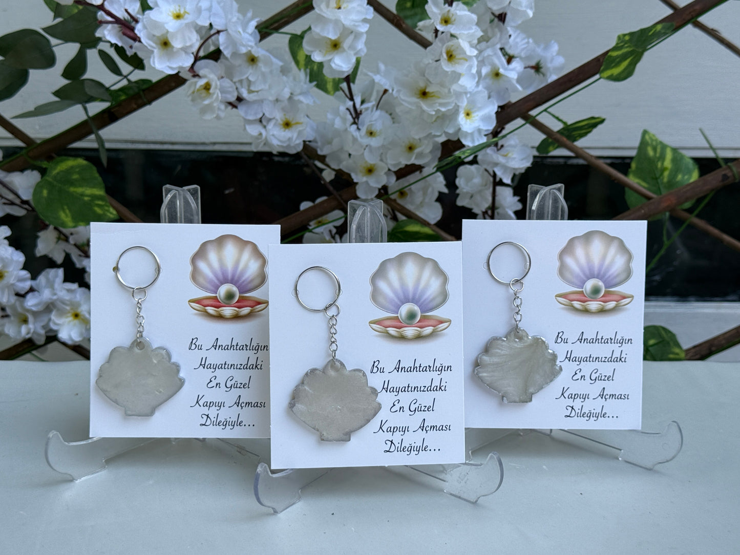 Gastgeschenk Set Epoxidharz-Muschelschlüsselanhänger mit Karte (für 50 Gäste)